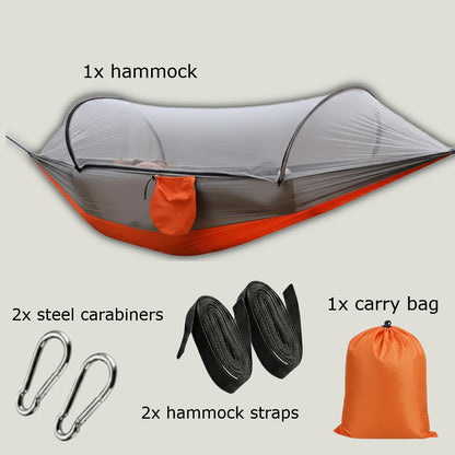 DANGL BushShield Hammock in red with orange fabric, set up outdoors with beige background, showcasing a comfortable outdoor hammock.